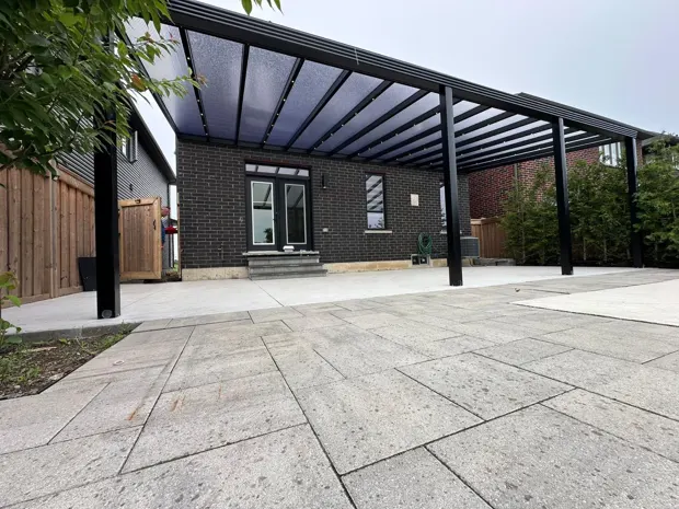Pergola framing a paved patio
