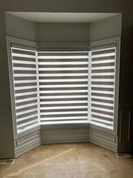 Window shades fitted around a bay window